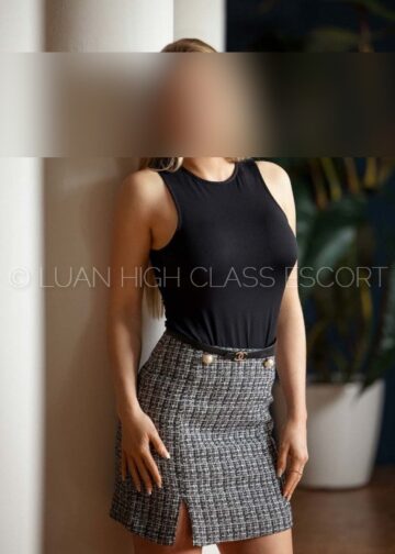 smart escort lady in a business outfit